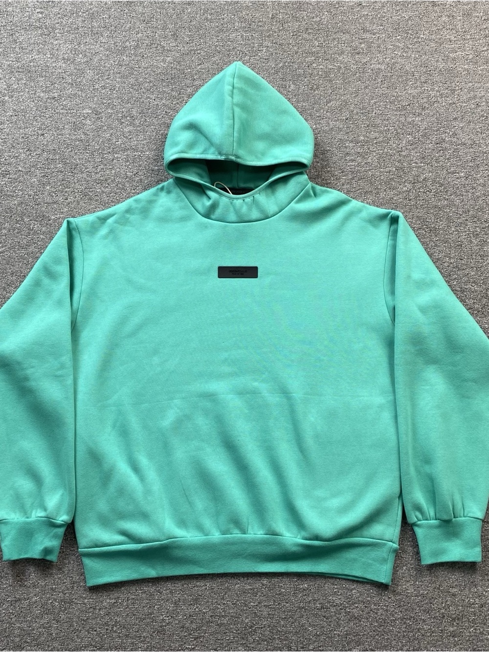Essentials Mint Green Pullover with Black Chest Patch